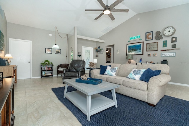 living room featuring ceiling fan and lofted ceiling