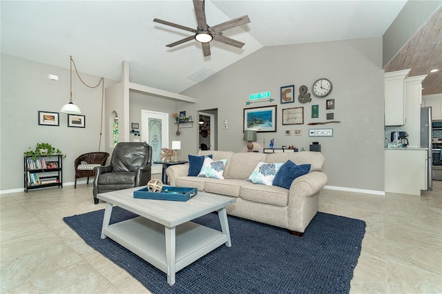 living room with ceiling fan and vaulted ceiling