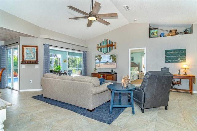 living room with vaulted ceiling, ceiling fan, and plenty of natural light