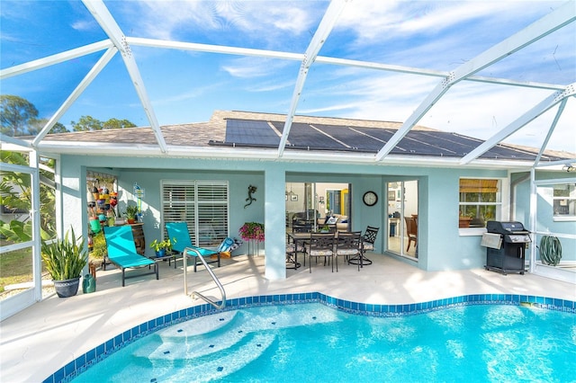 view of pool with a patio and a grill