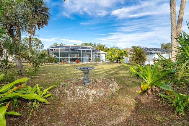 view of yard featuring glass enclosure