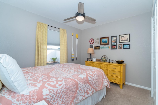 bedroom featuring ceiling fan and light carpet