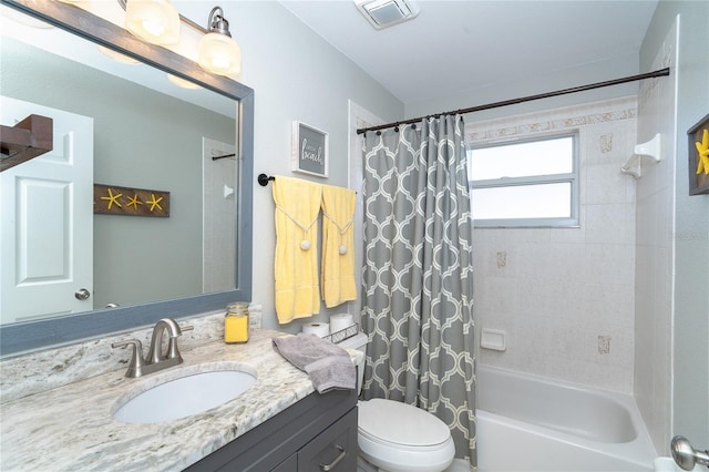 full bathroom with toilet, shower / tub combo, and vanity