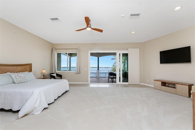 carpeted bedroom with ceiling fan and access to exterior