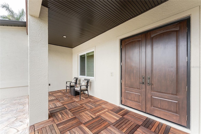 doorway to property featuring a porch