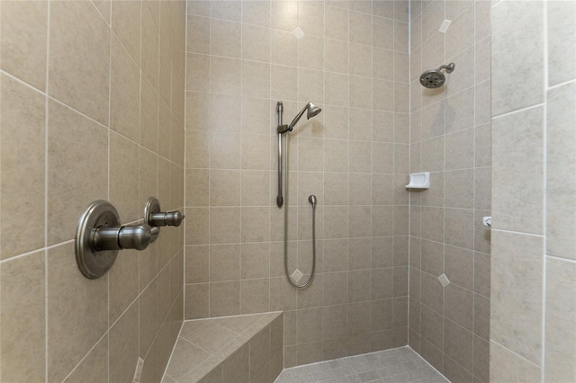 bathroom with a tile shower