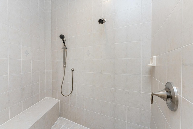 bathroom featuring tiled shower