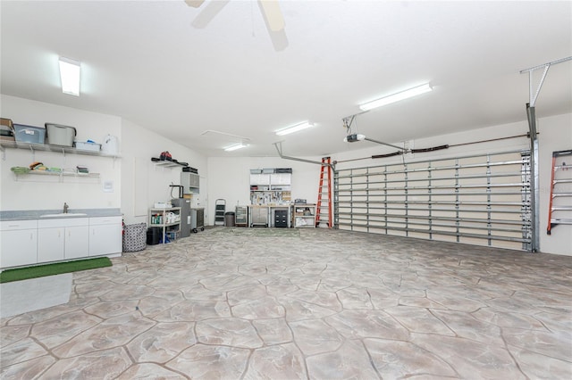 garage with ceiling fan, sink, and a garage door opener