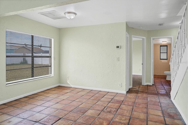 empty room featuring tile patterned flooring