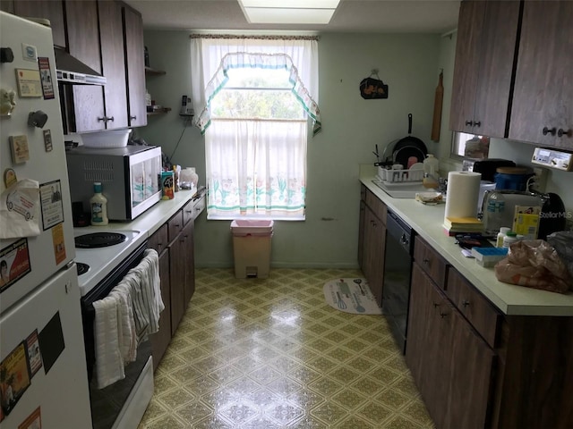 kitchen with white appliances and wall chimney exhaust hood