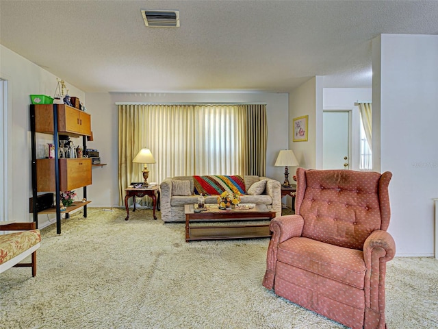 914 E 2nd St, Englewood, FL 34223 - carpeted living room featuring a textured ceiling