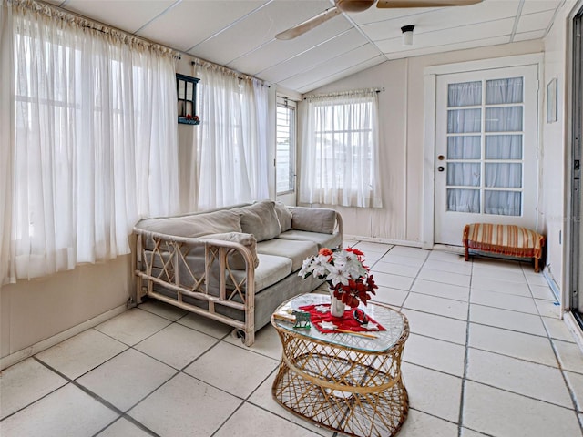 914 E 2nd St, Englewood, FL 34223 - living room with tile patterned floors, vaulted ceiling, ceiling fan, and baseboards