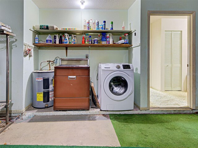 914 E 2nd St, Englewood, FL 34223 - laundry area featuring washer / dryer, electric water heater, and a textured ceiling