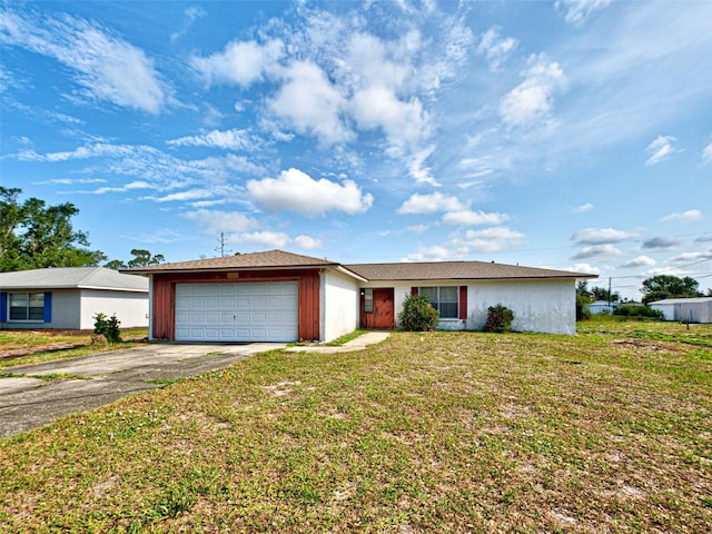914 E 2nd St, Englewood, FL 34223 - ranch-style house with asphalt driveway, an attached garage, and a front yard