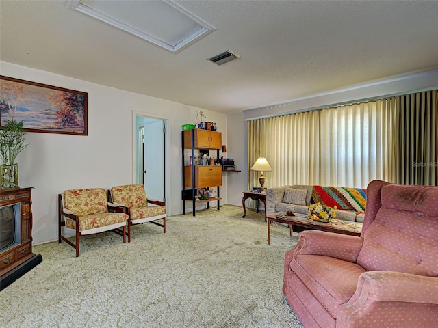 914 E 2nd St, Englewood, FL 34223 - carpeted living area featuring attic access