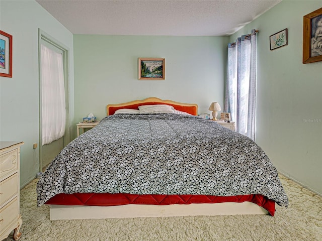 914 E 2nd St, Englewood, FL 34223 - carpeted bedroom with a textured ceiling