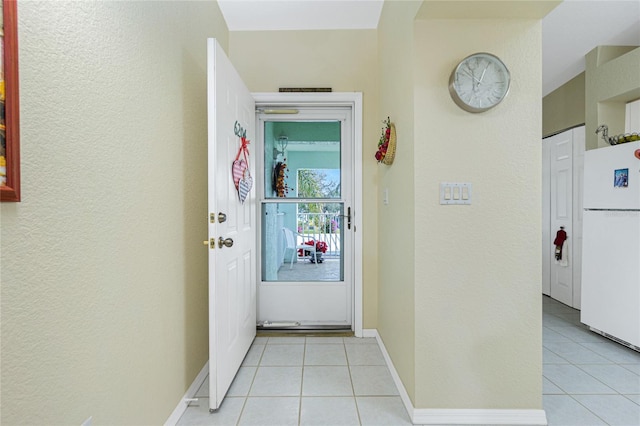 corridor featuring light tile patterned floors