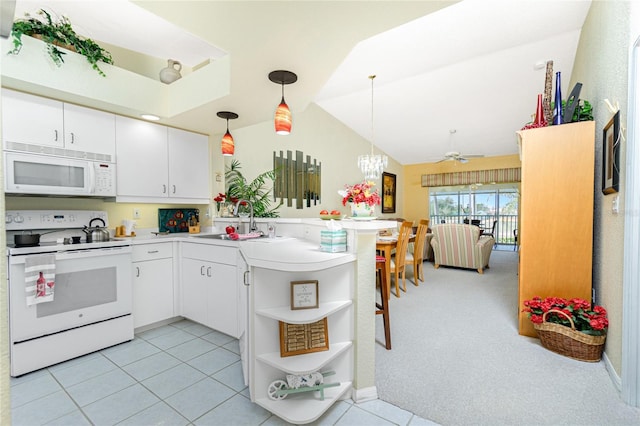 kitchen featuring white cabinetry, white appliances, kitchen peninsula, and hanging light fixtures