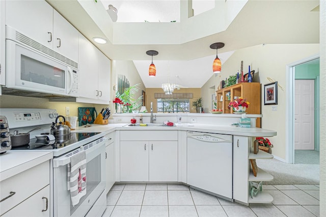 kitchen featuring kitchen peninsula, hanging light fixtures, sink, white cabinetry, and white appliances