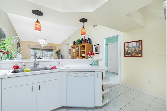 kitchen with hanging light fixtures, white dishwasher, sink, light tile patterned flooring, and a notable chandelier