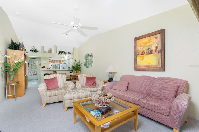 living room featuring vaulted ceiling, ceiling fan, and light carpet