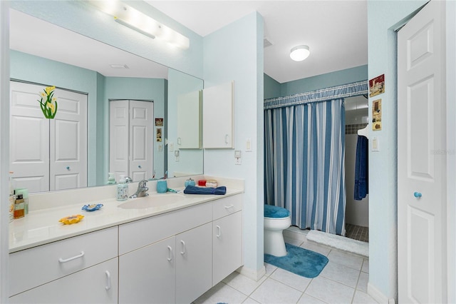 bathroom featuring vanity, toilet, a shower with shower curtain, and tile patterned flooring