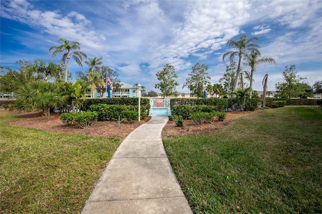 view of home's community featuring a lawn