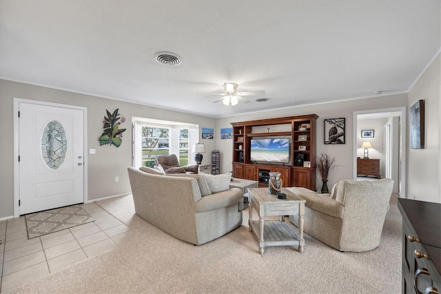 tiled living room featuring ceiling fan