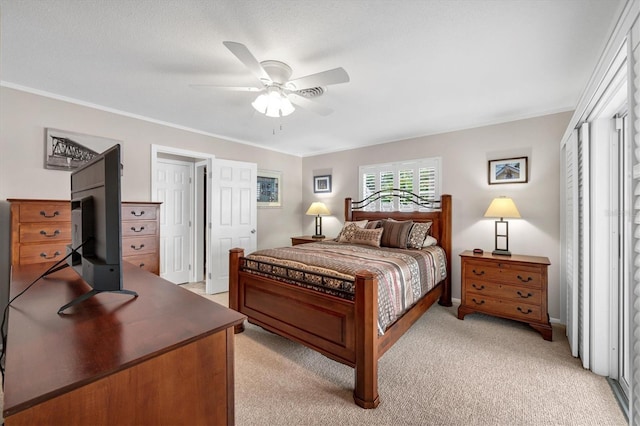 bedroom featuring light carpet, ornamental molding, and ceiling fan