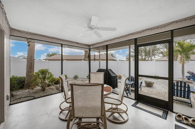 sunroom / solarium with ceiling fan and a wealth of natural light