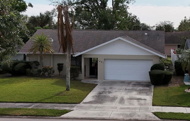 single story home with a front lawn and a garage