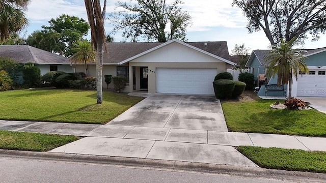 single story home with a garage and a front yard