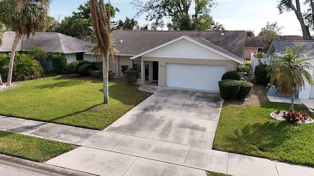 single story home featuring a front lawn and a garage