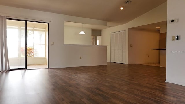 unfurnished living room with dark hardwood / wood-style flooring and lofted ceiling