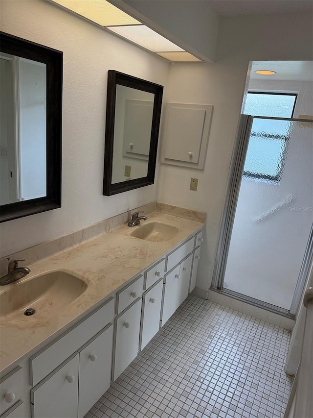 bathroom featuring tile patterned floors and vanity