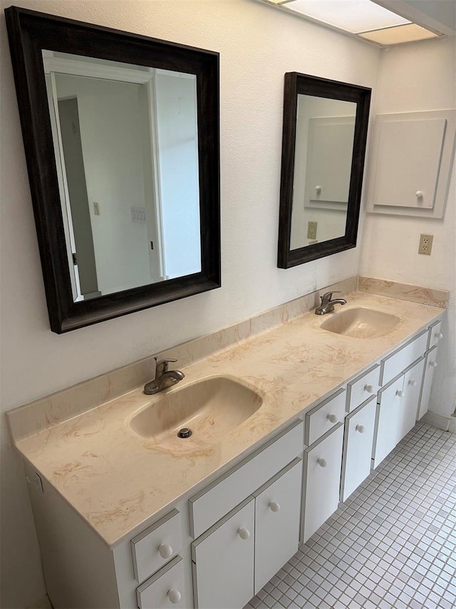 bathroom with vanity and tile patterned flooring