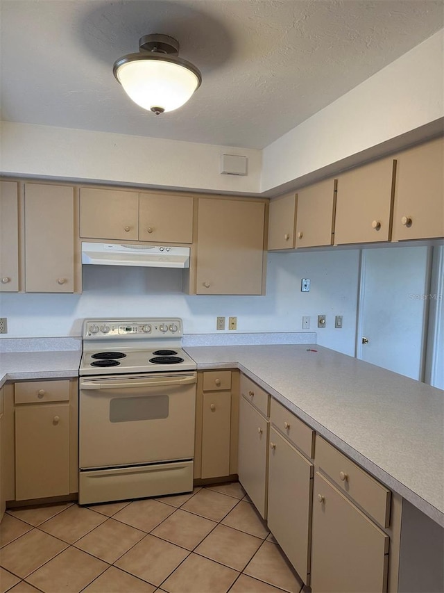 kitchen with a textured ceiling, light tile patterned flooring, and white electric range oven