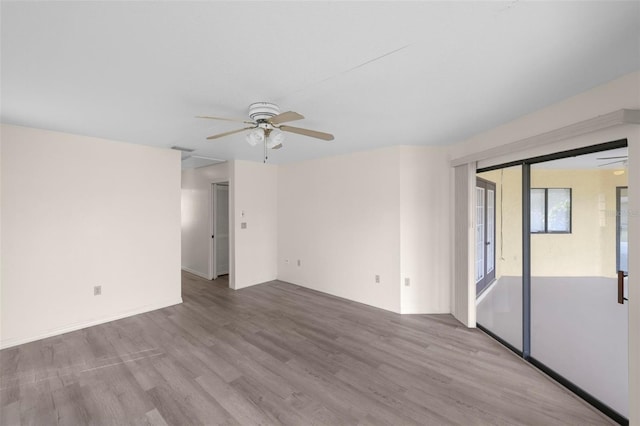 spare room with ceiling fan and light hardwood / wood-style flooring