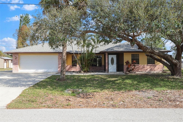 single story home with a front yard and a garage