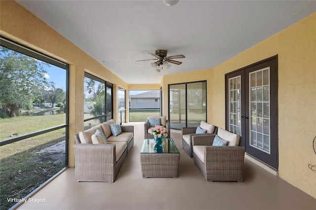 sunroom / solarium with french doors and ceiling fan