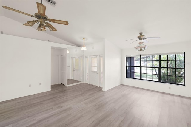 unfurnished living room with ceiling fan, light hardwood / wood-style flooring, and vaulted ceiling