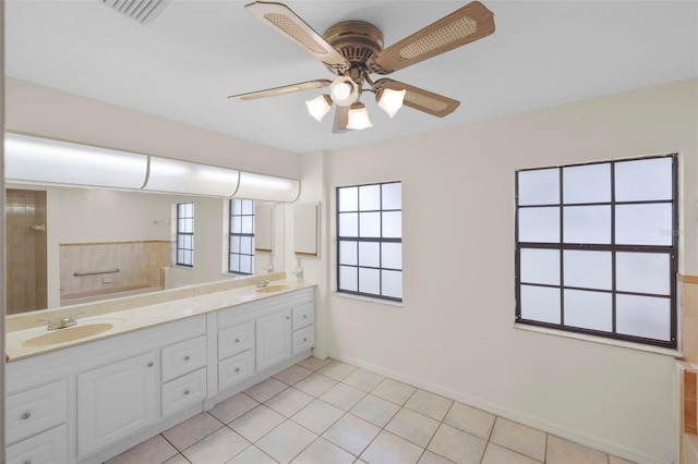 bathroom with ceiling fan, tile patterned flooring, and vanity