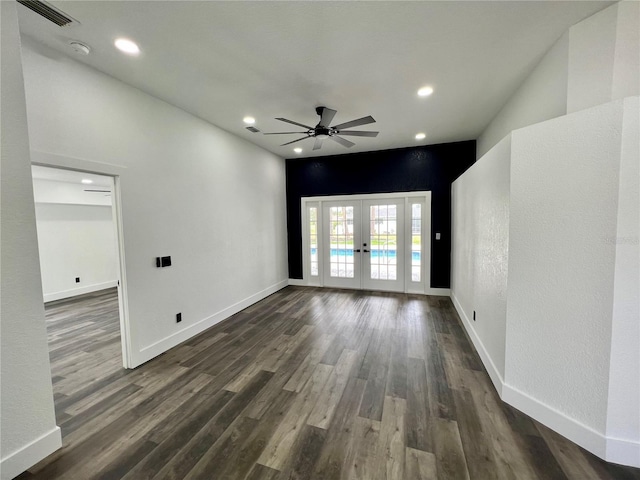 spare room featuring dark hardwood / wood-style flooring, french doors, and ceiling fan