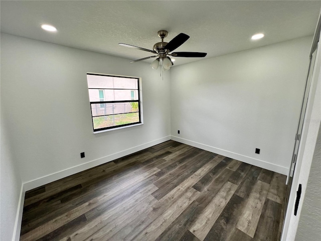 spare room featuring a textured ceiling, dark hardwood / wood-style floors, and ceiling fan