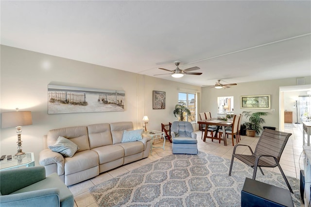 tiled living room with ceiling fan