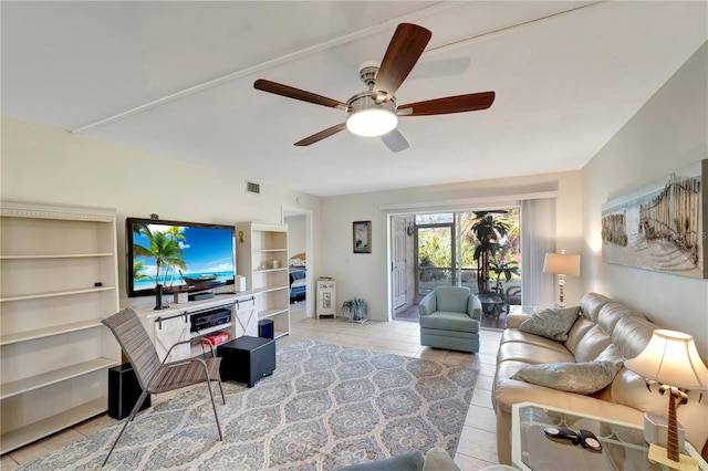 living room featuring ceiling fan and light tile patterned floors