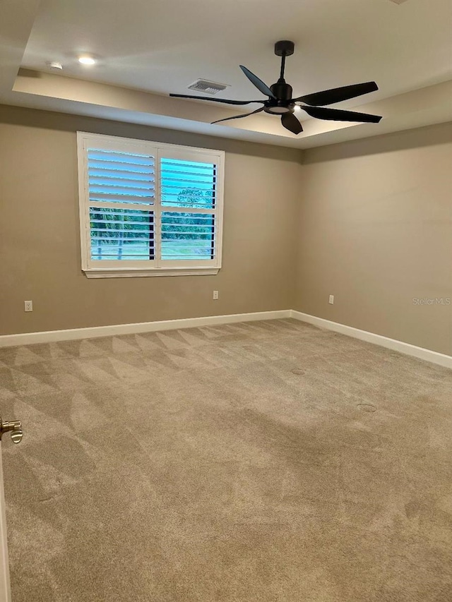 carpeted empty room with ceiling fan