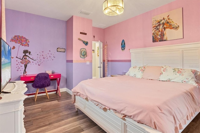 bedroom with dark wood-type flooring