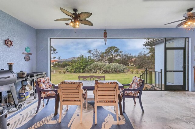 interior space with ceiling fan