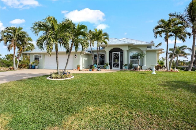 single story home with a garage and a front lawn